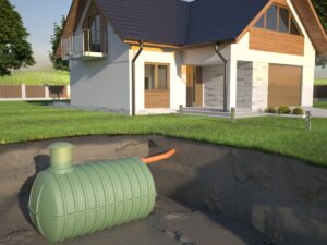 Unterirdisch installierter Kunststofftank fuer Regenwasser vor einem Neubau